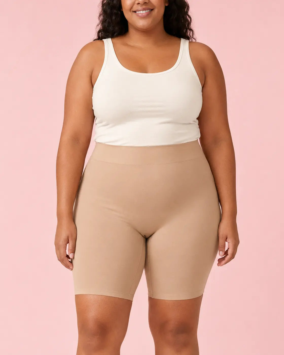 Model wearing the beige LYROVA shorts from the front