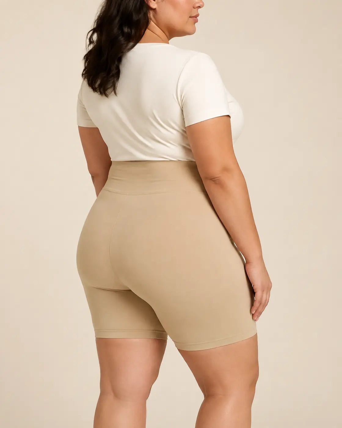 Side view of the beige LYROVA shorts