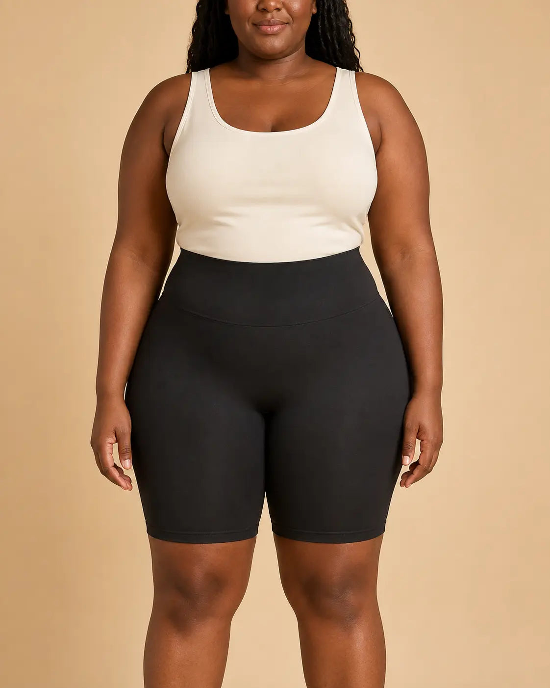 Model wearing the black LYROVA shorts from the front