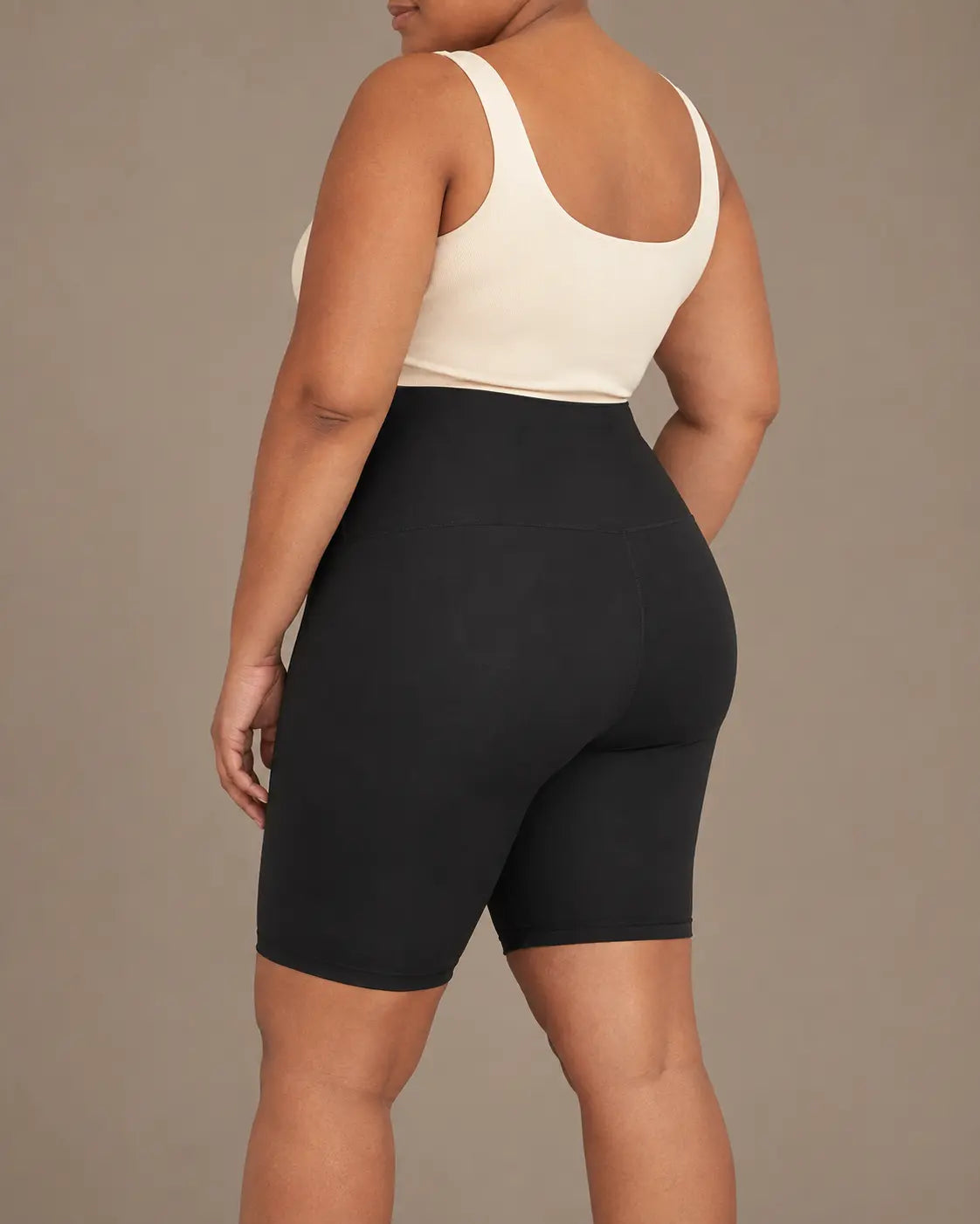 Side view of the black LYROVA shorts
