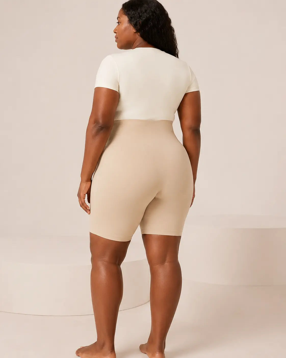 Beige LYROVA anti-chafing shaping shorts in a studio